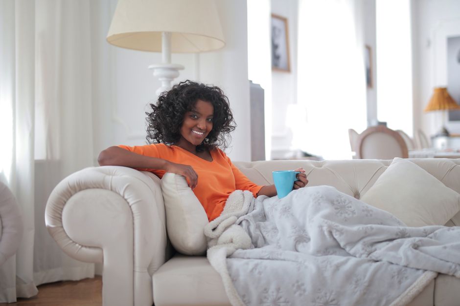 person resting cozy blanket home