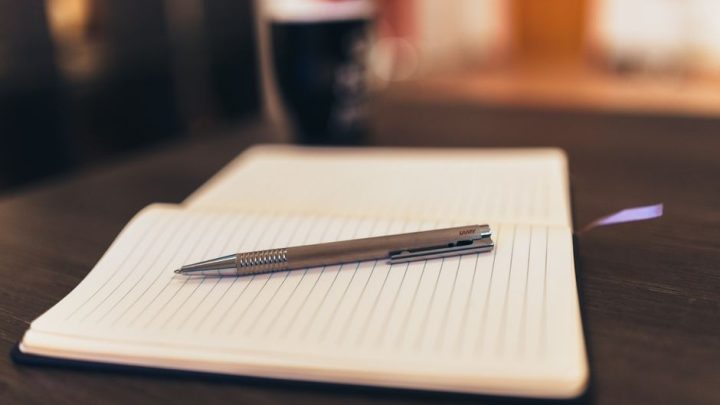 notebook pen sunny desk