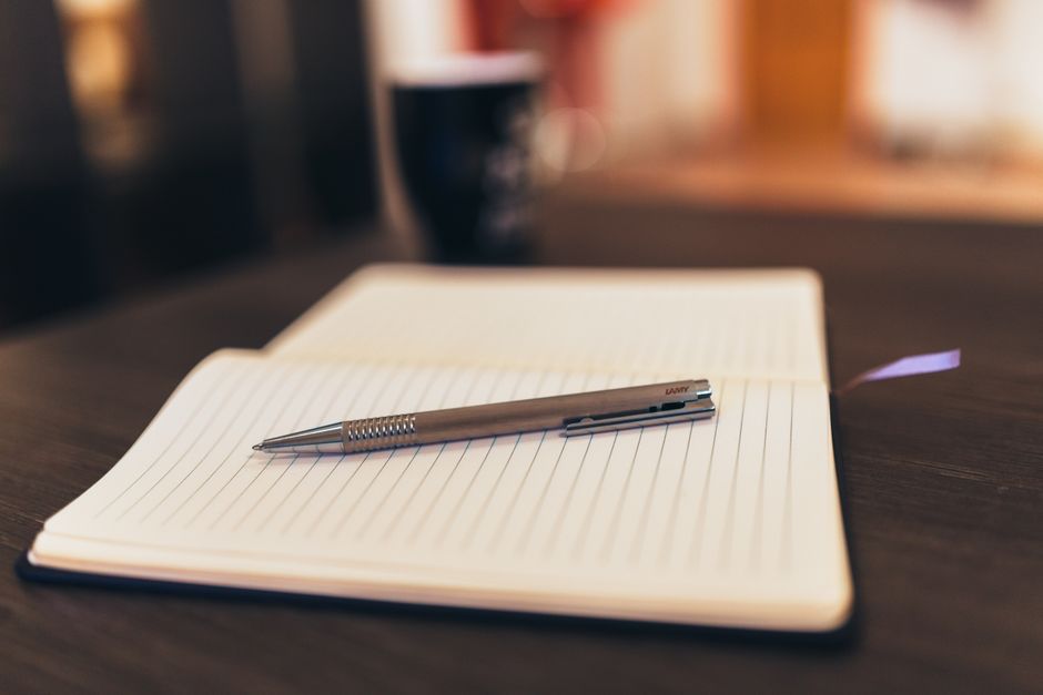 notebook pen sunny desk