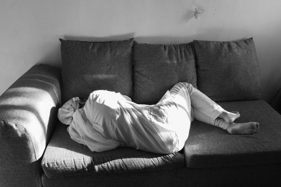 person resting on couch