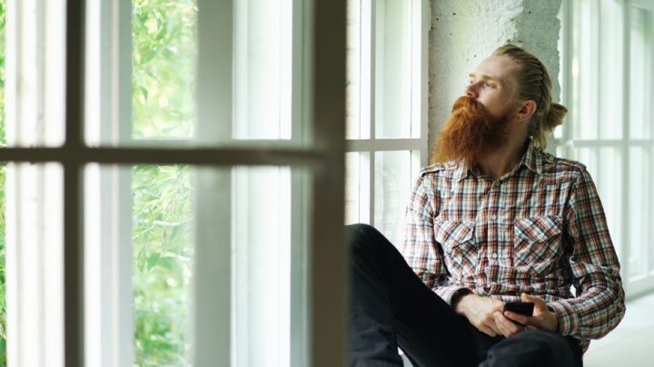 person sitting quietly window